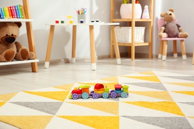 Photo of Colorful train and other toys in child's room