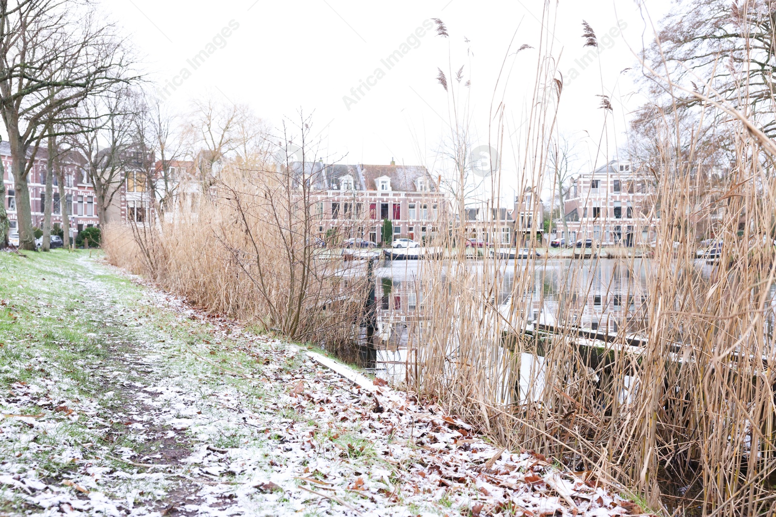 Photo of Picturesque view of water canal and buildings in city on winter day