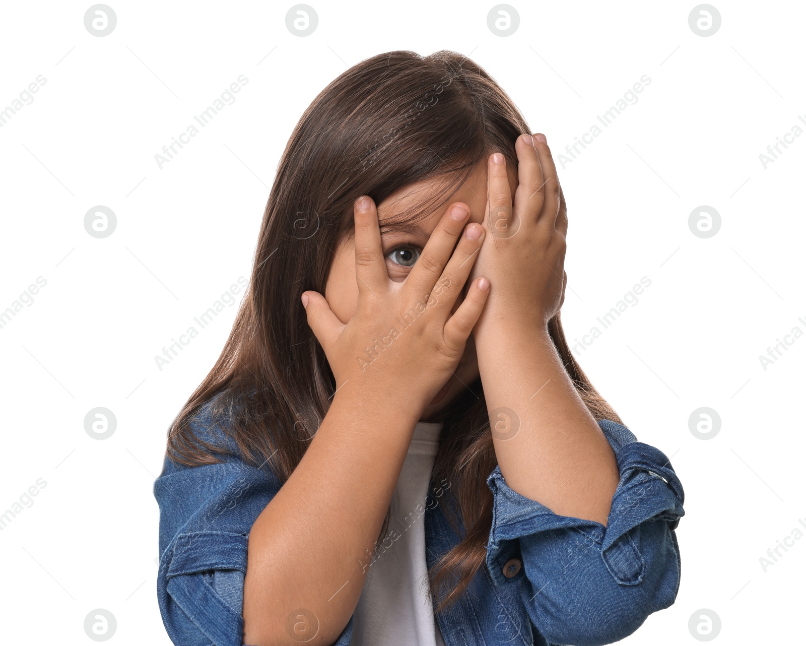 Photo of Scared little girl covering face with hands on white background