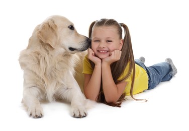 Girl with her cute Golden Retriever dog lying on white background