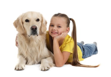 Girl with her cute Golden Retriever dog lying on white background