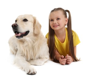 Girl with her cute Golden Retriever dog lying on white background