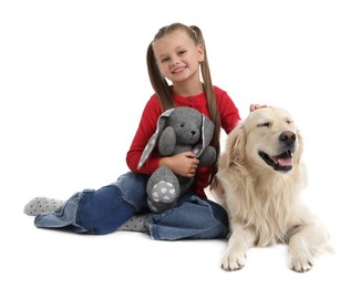 Girl with toy bunny and her cute Golden Retriever dog on white background