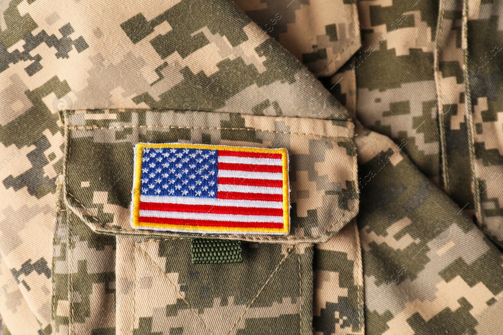 Photo of Veterans day. USA army patch on military uniform, closeup