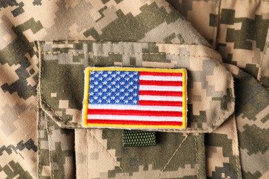 Photo of Veterans day. USA army patch on military uniform, closeup