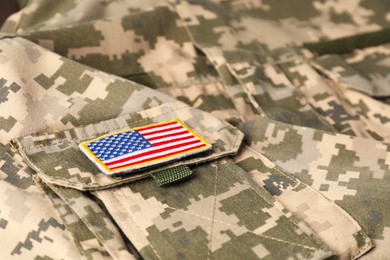 Photo of Veterans day. USA army patch on military uniform, closeup