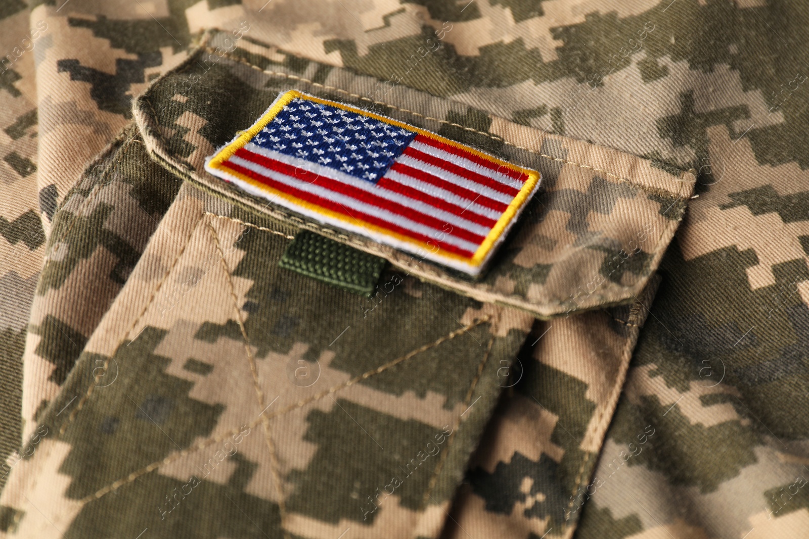 Photo of Veterans day. USA army patch on military uniform, closeup