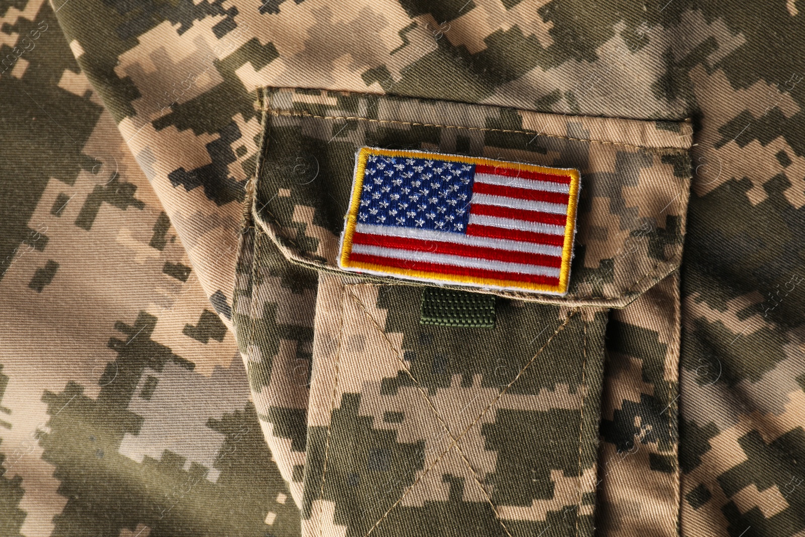 Photo of Veterans day. USA army patch on military uniform, closeup