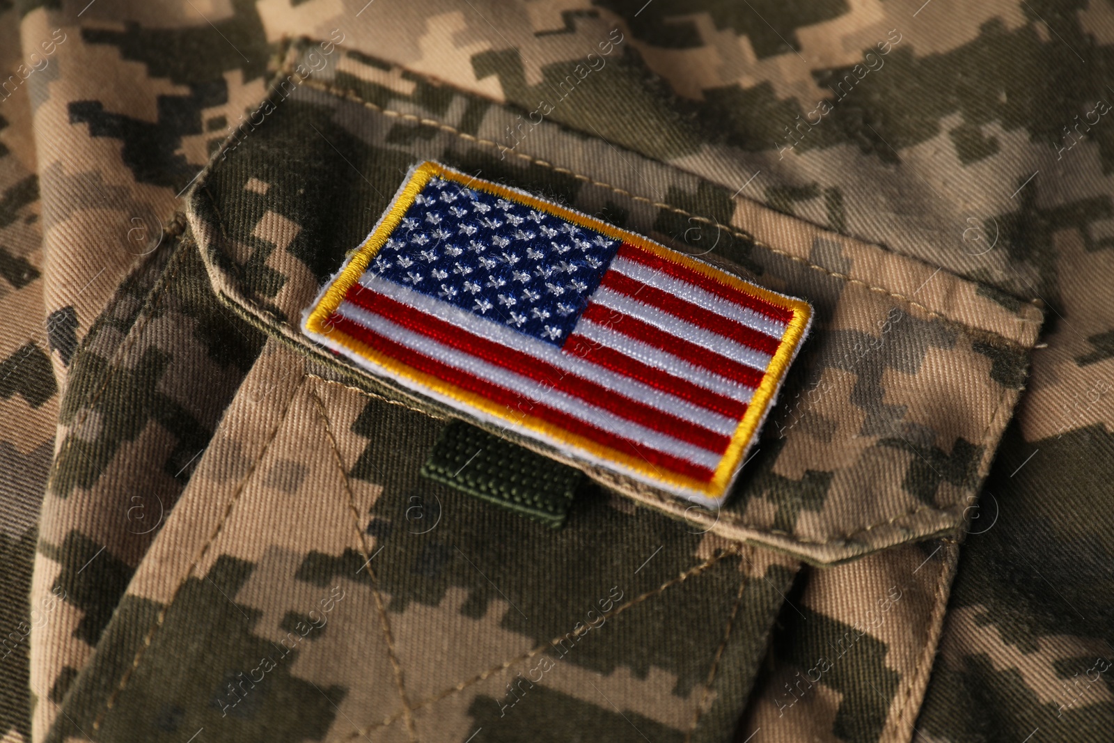 Photo of Veterans day. USA army patch on military uniform, closeup