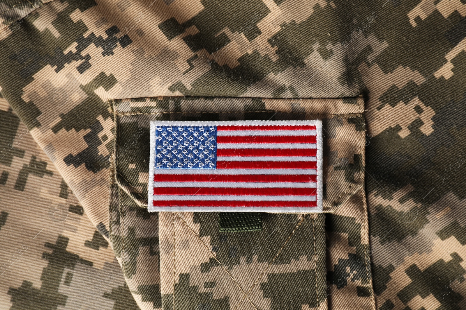 Photo of Veterans day. USA army patch on military uniform, closeup