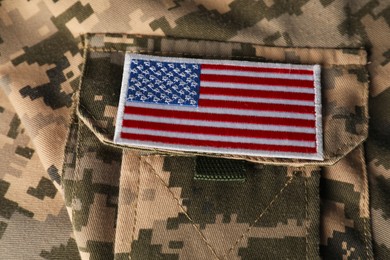 Photo of Veterans day. USA army patch on military uniform, closeup