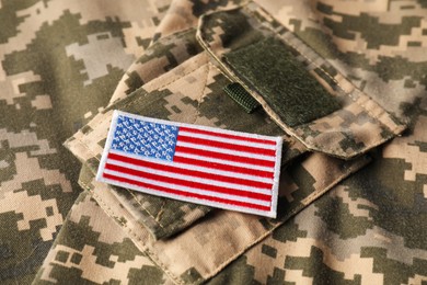 Photo of Veterans day. USA army patch on military uniform, closeup