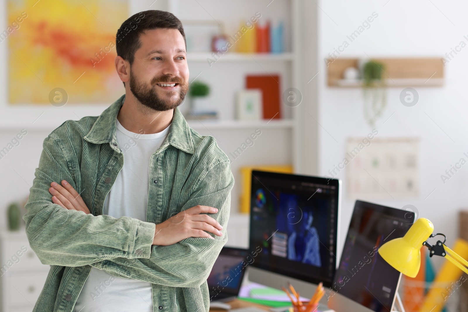 Photo of Portrait of smiling designer in modern office