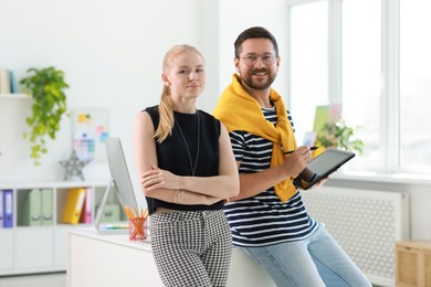 Designers with tablet working together in office