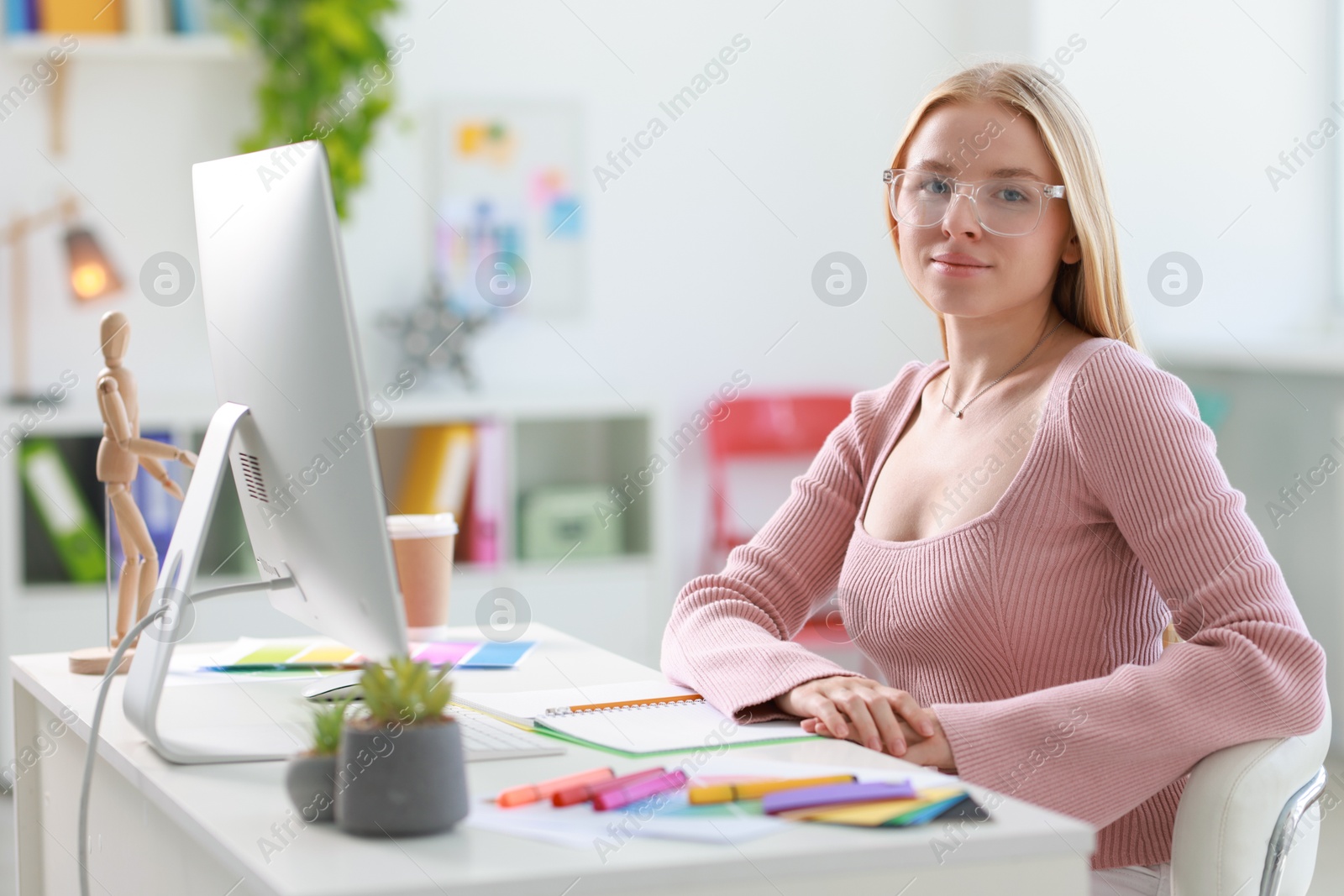 Photo of Designer working with computer at table in office