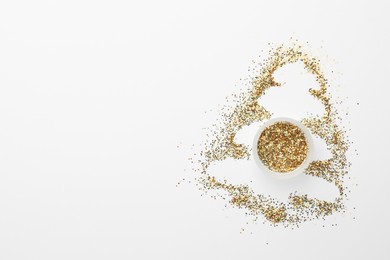 Photo of Christmas tree made of glitter on white background, top view. Space for text