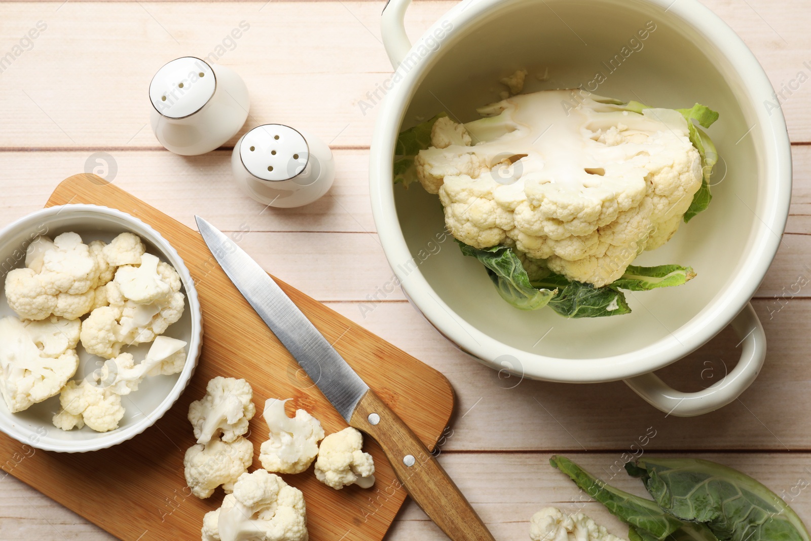 Photo of Cauliflower on white wooden table, flat lay. Washing, cutting, cooking