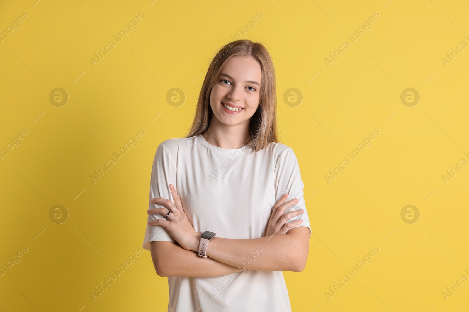 Photo of Portrait of teenage girl on yellow background