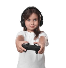 Photo of Cute little girl in headphones playing video game with controller on white background