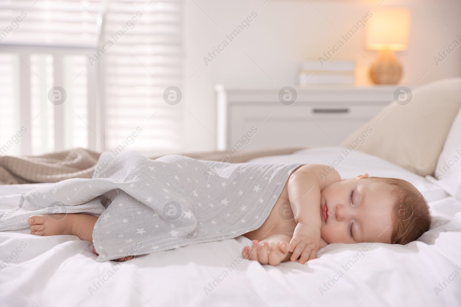 Photo of Cute little baby sleeping on bed at home