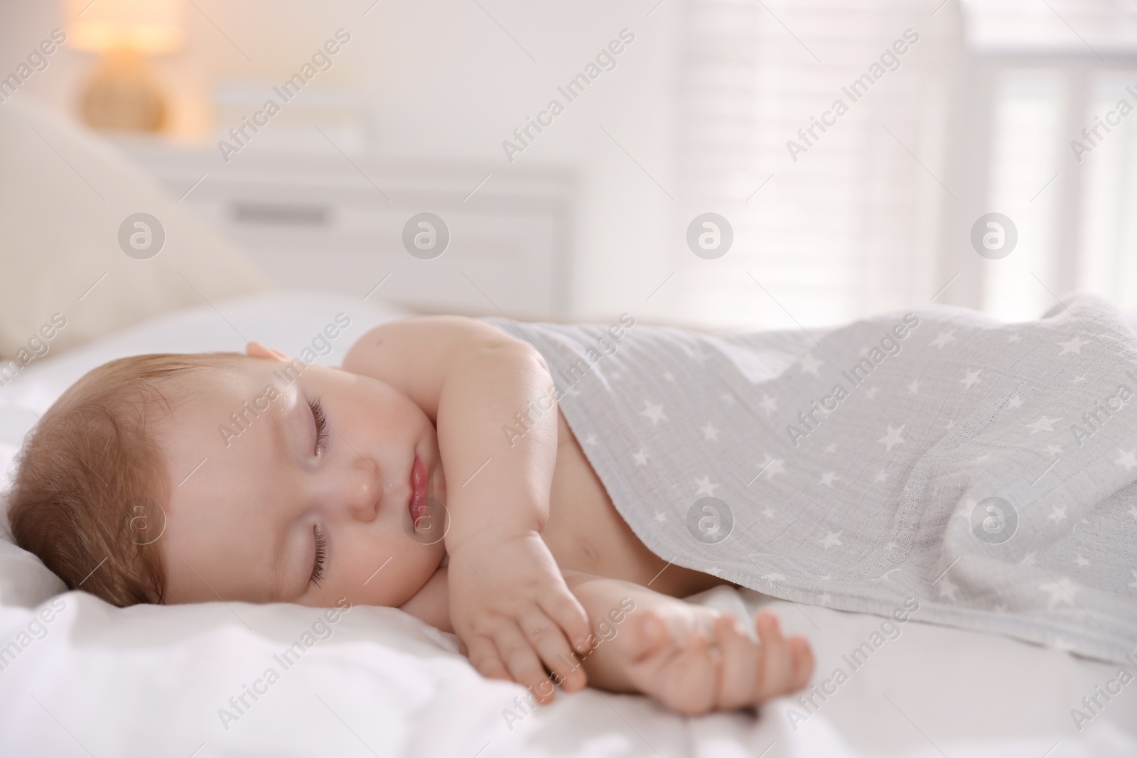 Photo of Cute little baby sleeping on bed at home