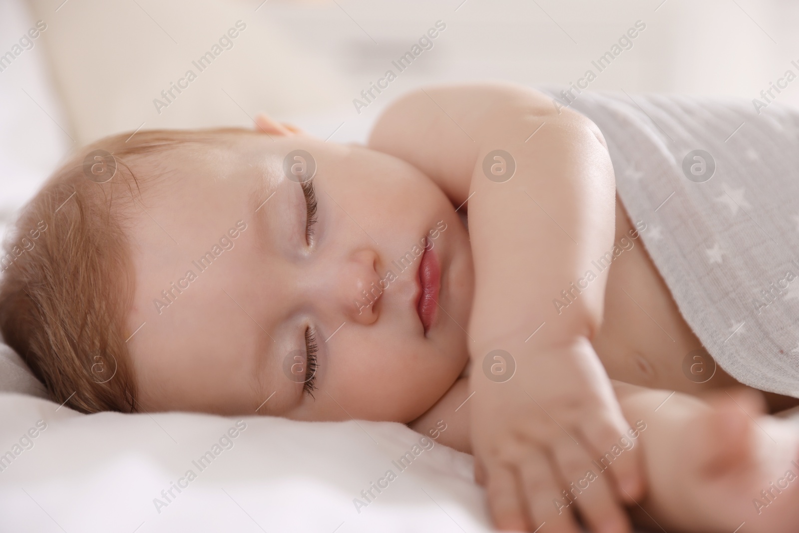 Photo of Cute little baby sleeping on bed at home