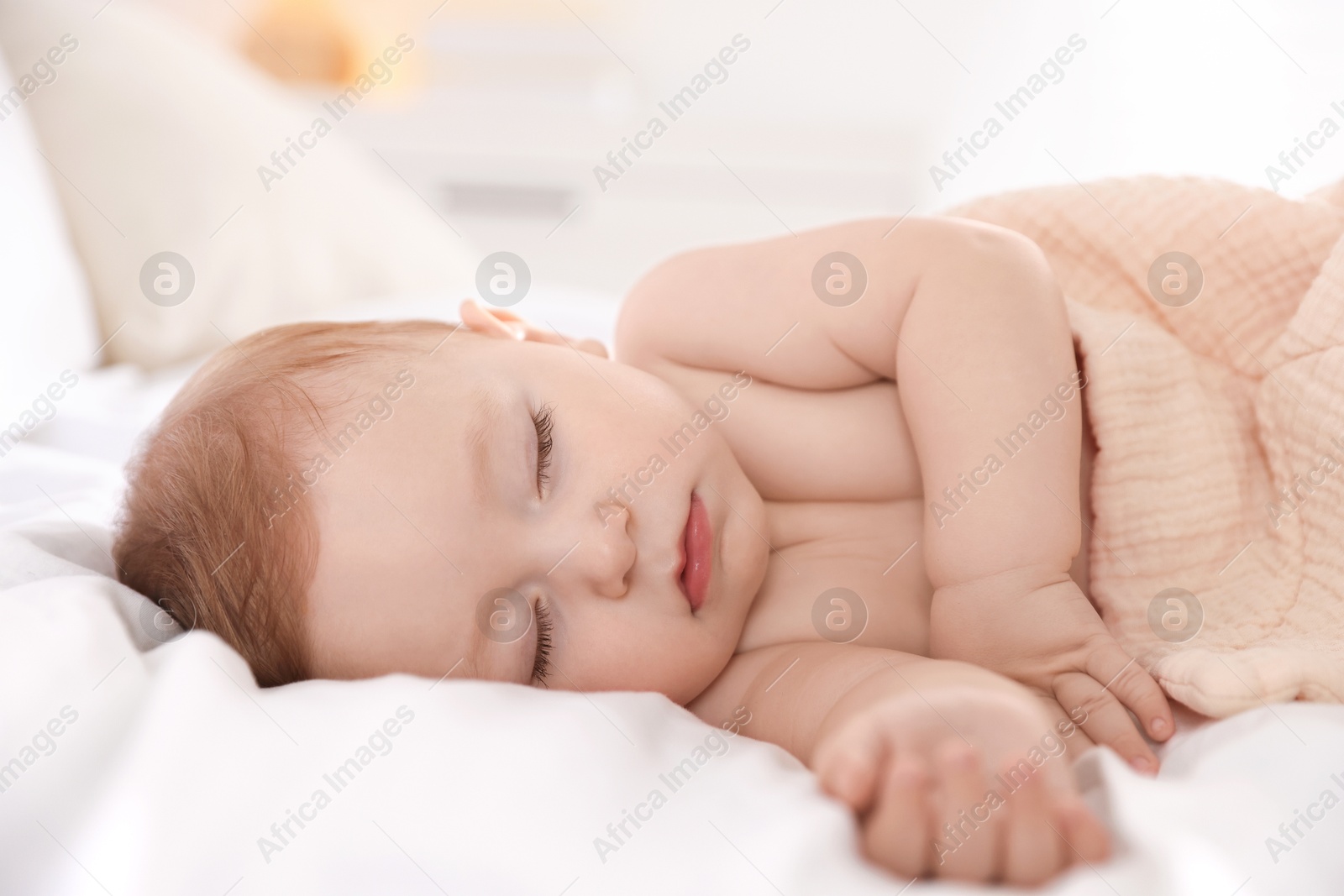 Photo of Cute little baby sleeping on bed at home