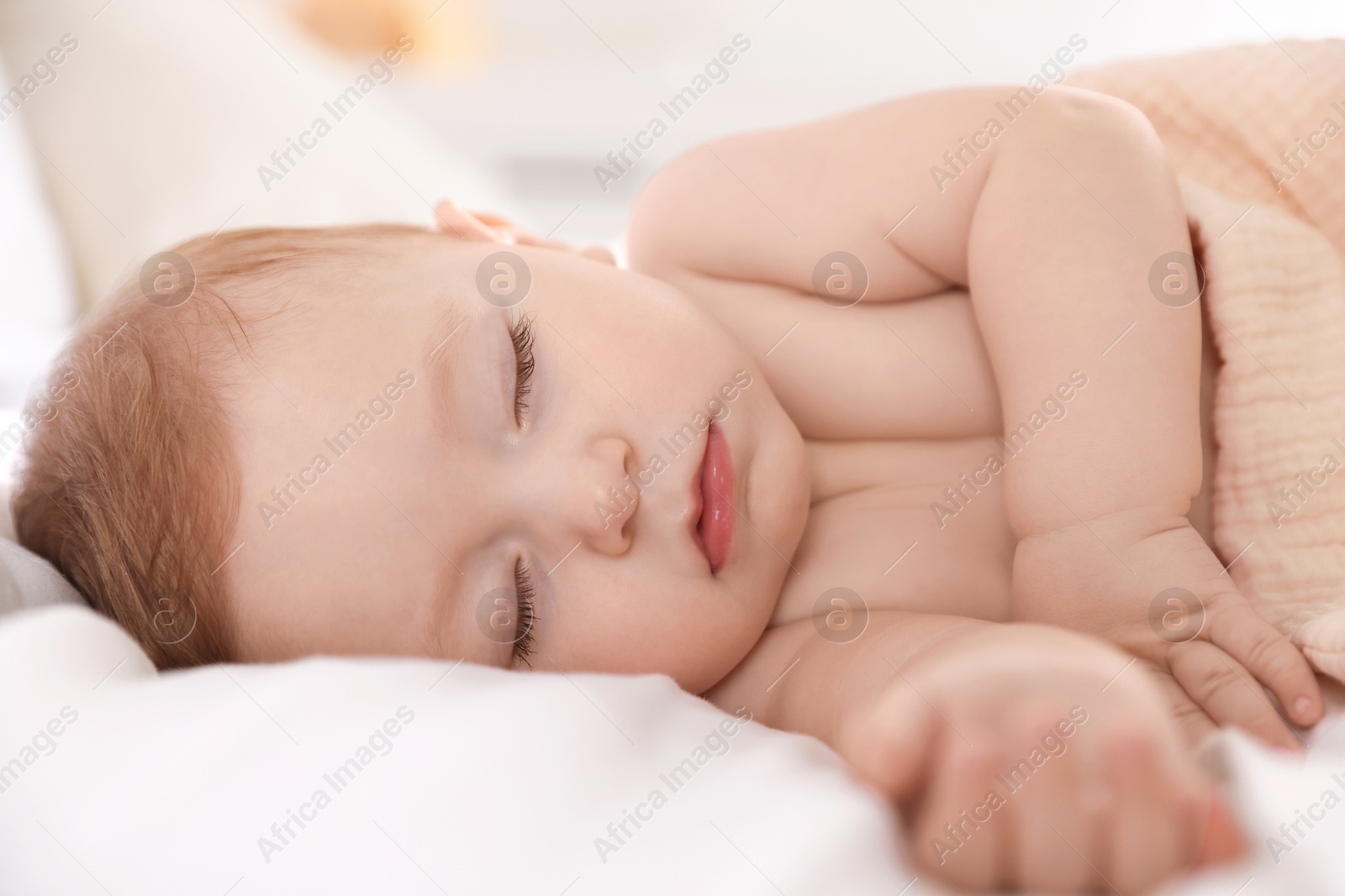 Photo of Cute little baby sleeping on bed at home