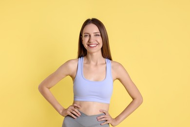 Photo of Portrait of happy winner on yellow background