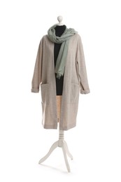 Photo of Female mannequin with beige cardigan and scarf isolated on white