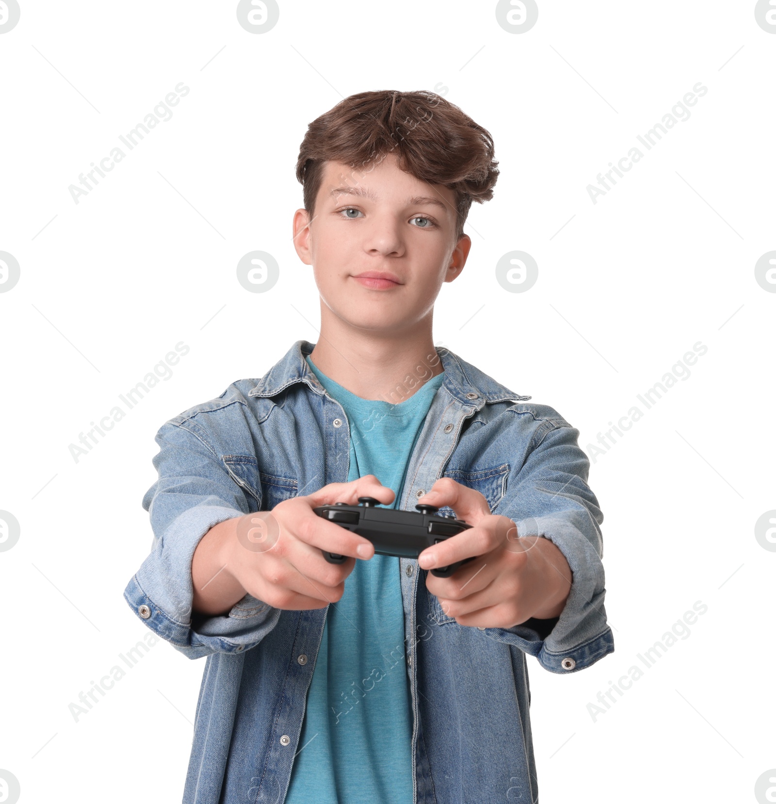 Photo of Teenage boy playing video game with controller on white background