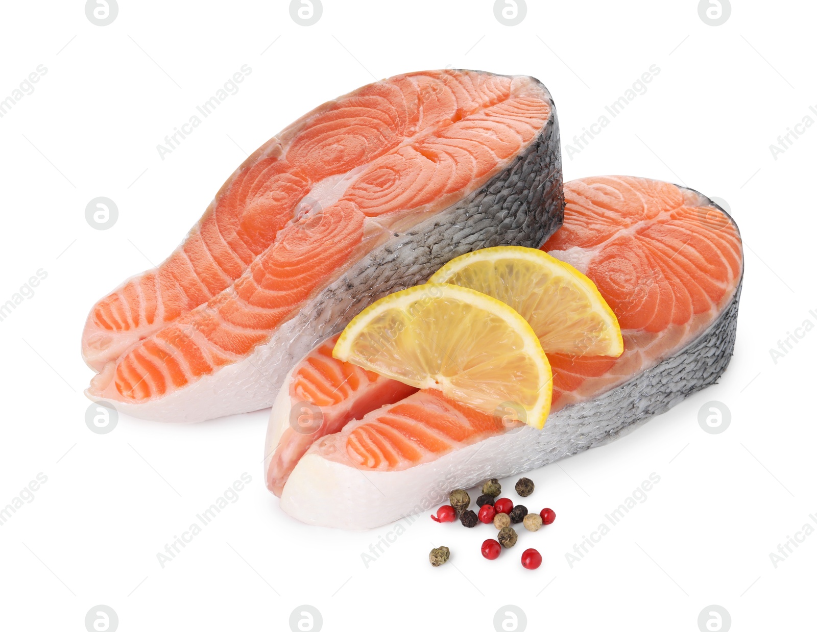 Photo of Steaks of fresh raw salmon and spices isolated on white