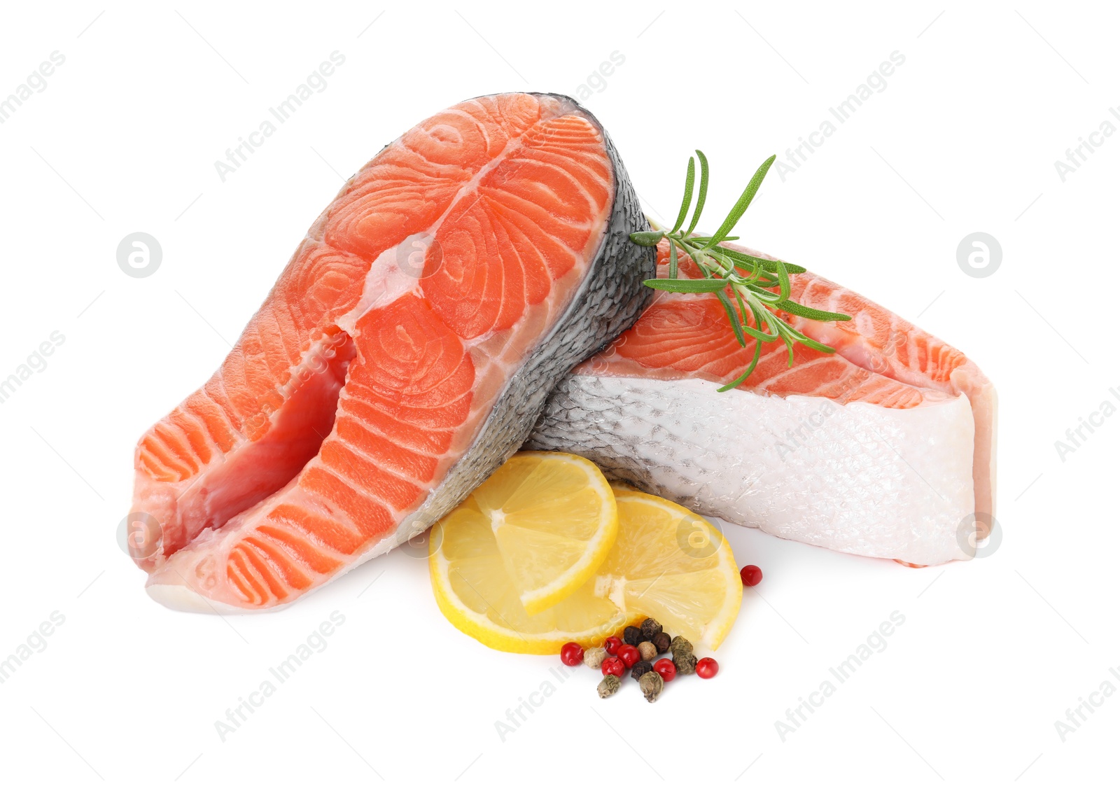 Photo of Steaks of fresh raw salmon and spices isolated on white