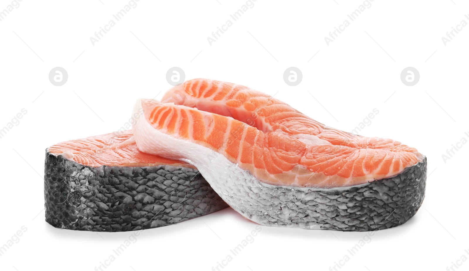 Photo of Steaks of fresh raw salmon isolated on white