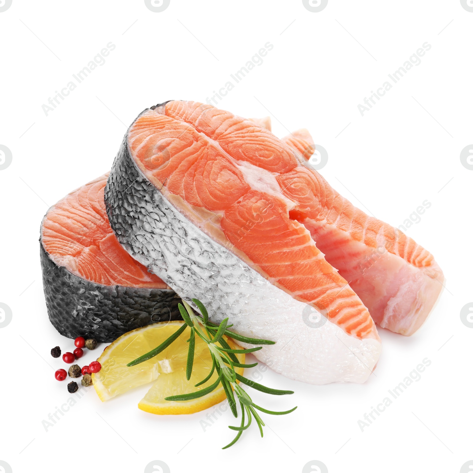 Photo of Steaks of fresh raw salmon and spices isolated on white