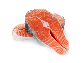 Photo of Steaks of fresh raw salmon isolated on white