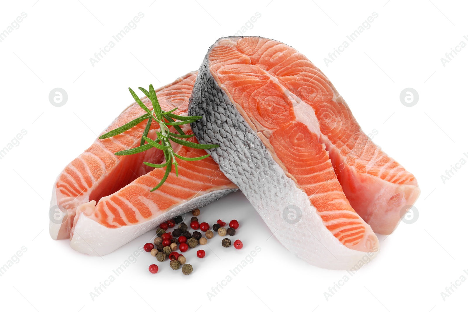 Photo of Steaks of fresh raw salmon and spices isolated on white