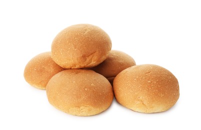 Photo of Many fresh tasty buns isolated on white