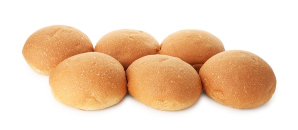 Photo of Many fresh tasty buns isolated on white