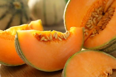 Photo of Cut ripe Cantaloupe melon on table, closeup