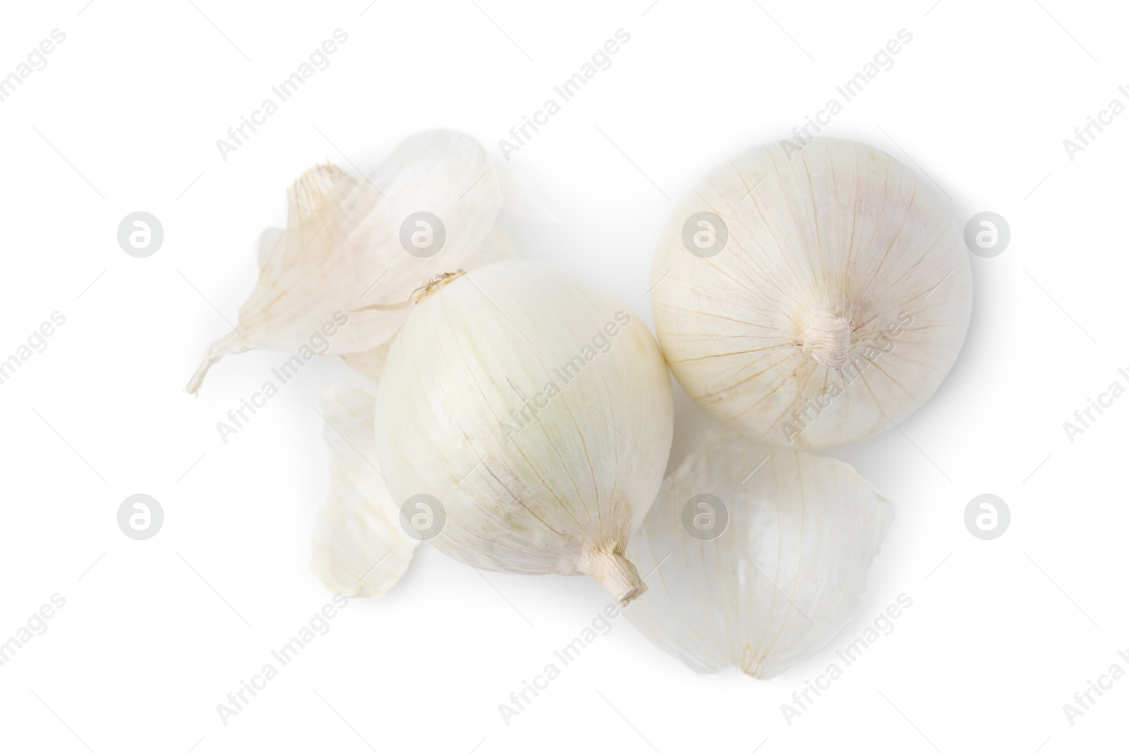 Photo of Fresh onions with peels isolated on white, top view