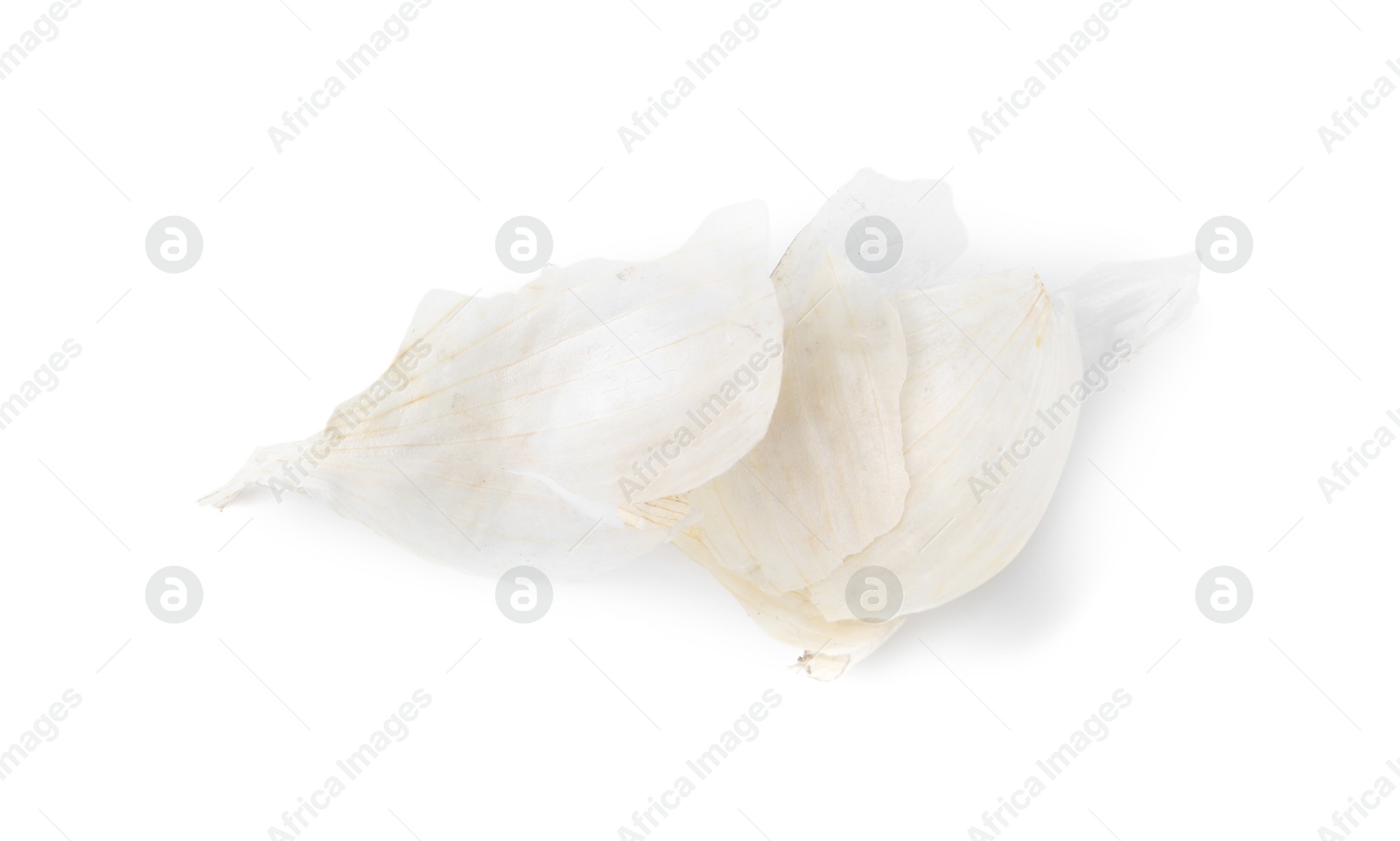 Photo of Onion peels isolated on white, top view