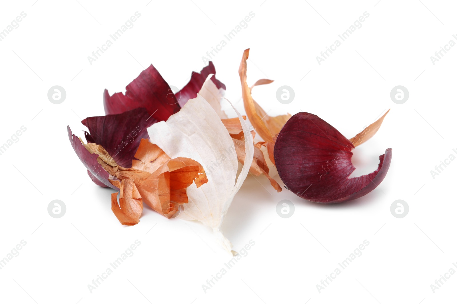 Photo of Pile of different onion peels isolated on white