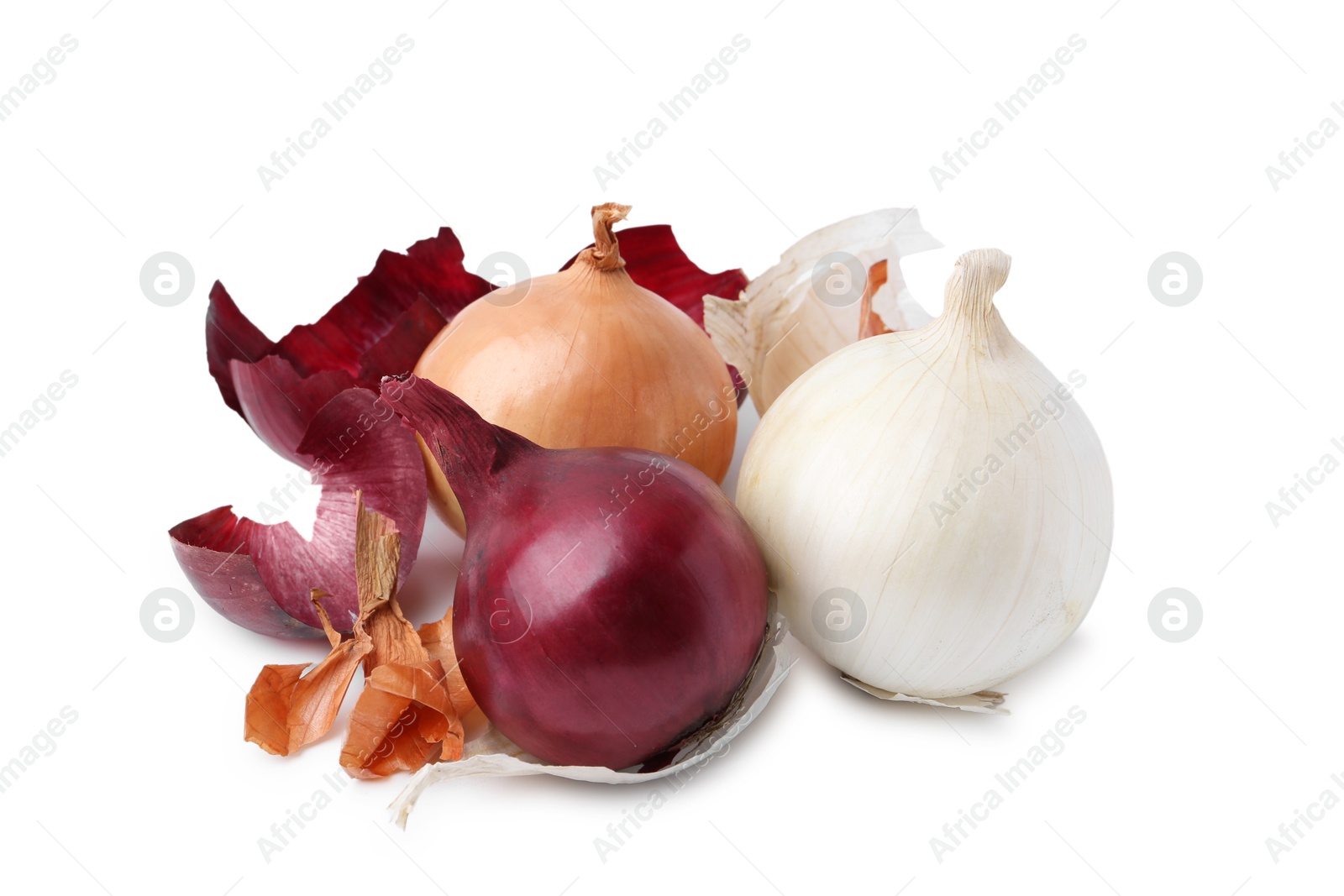 Photo of Fresh onions with peels isolated on white