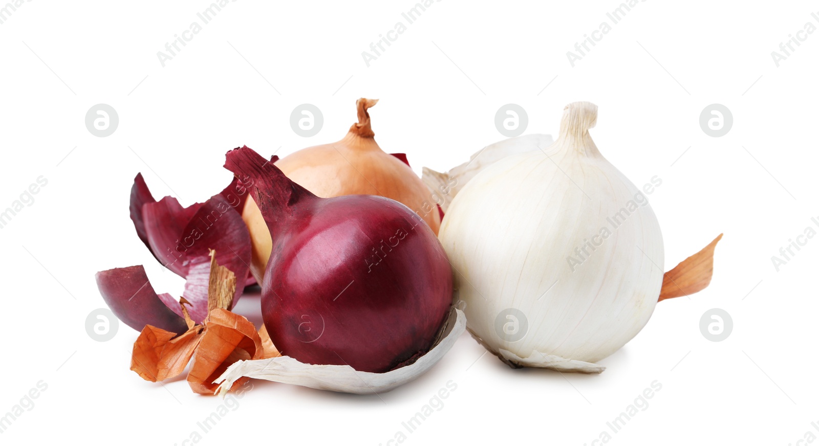 Photo of Fresh onions with peels isolated on white