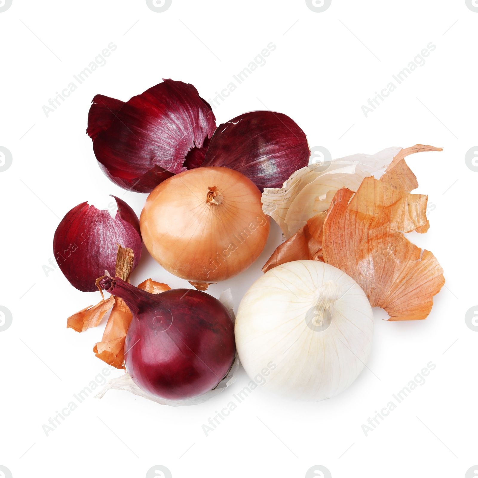 Photo of Fresh onions with peels isolated on white, top view