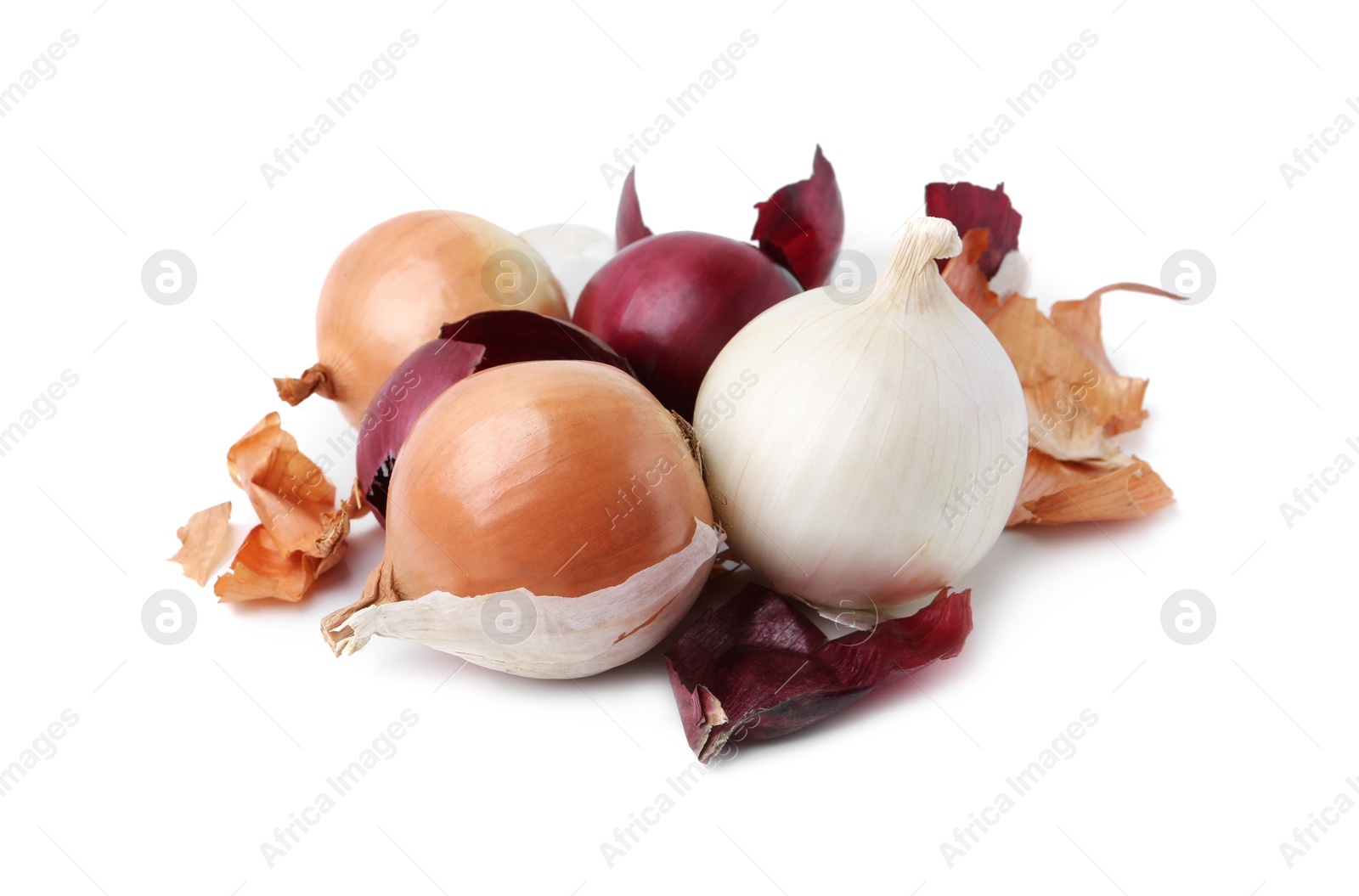 Photo of Fresh onions with peels isolated on white