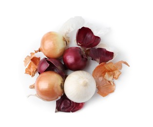 Photo of Fresh onions with peels isolated on white, top view