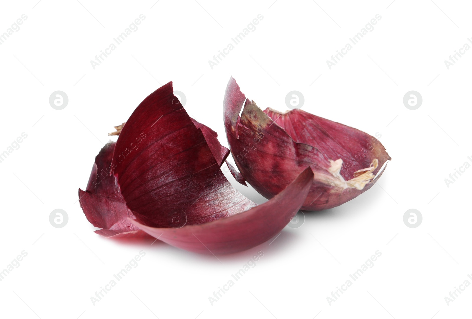 Photo of Pieces of onion peels isolated on white