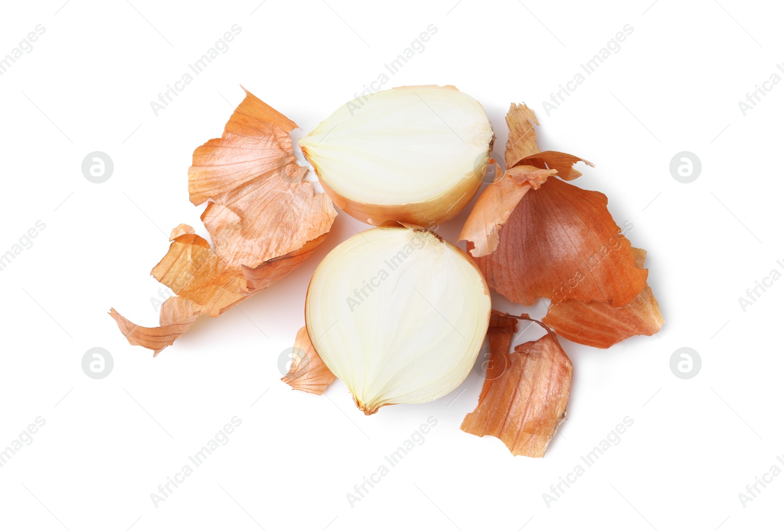 Photo of Halves of fresh onion with peels isolated on white, top view